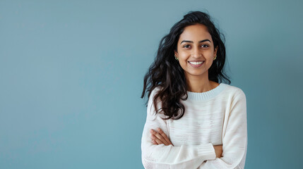 Happy, prosperous Desi woman standing with confidence in her casual attire and grinning at the camera copy space