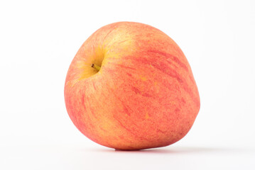 Fresh ripe apple with tiny water drops on white background