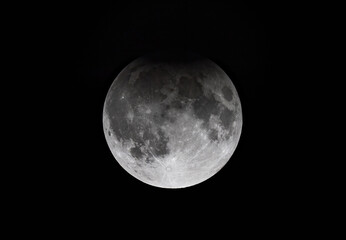 Wall Mural - shadow of the earth during the partial harvest supermoon lunar eclipse september 17, 2024 over ottaw