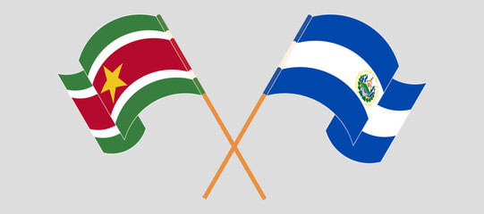 Crossed and waving flags of Suriname and Republic of El Salvador. Vector illustration