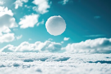 Poster - A Round Snowball Suspended in Mid-Air Against a Blue Sky and Fluffy Clouds