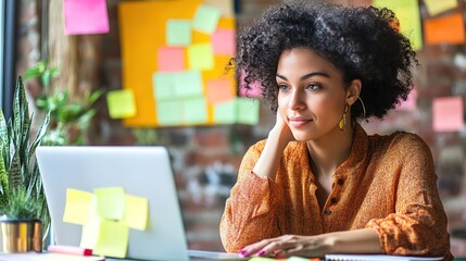 Sticker - A thoughtful woman with curly hair gazes at her laptop, surrounded by colorful sticky notes, reflecting a creative workspace atmosphere.