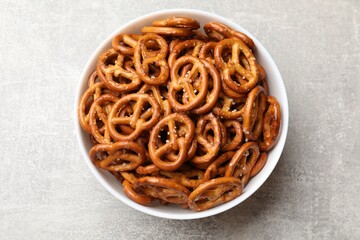 Wall Mural - Delicious pretzel crackers on light table, top view