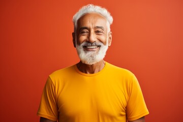 Poster - Portrait of a happy indian elderly man in his 90s sporting a breathable hiking shirt in front of vibrant yoga studio background