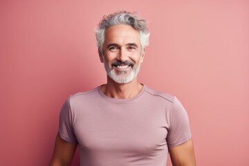 Canvas Print - Portrait of a content afro-american man in his 50s wearing a moisture-wicking running shirt isolated in pastel or soft colors background