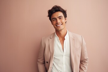 Poster - Portrait of a happy man in his 20s dressed in a stylish blazer on pastel or soft colors background