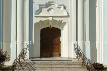 The old building of the Catholic Church. The building has a cultural and historical value. White walls and vaulted ceilings.