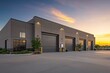 © Kenny - Modern industrial warehouse with large garage doors at sunset