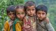 © Kiron - Some helpless helpless children stand together looking at the camera. Ai generated