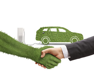 Poster - Businessman shaking hand with a hand covered in grass in front of green electric vehicle at a charging station