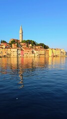 Wall Mural - rovinj, croatia, offers breathtaking views with colorful buildings mirrored in calm waters at sunris