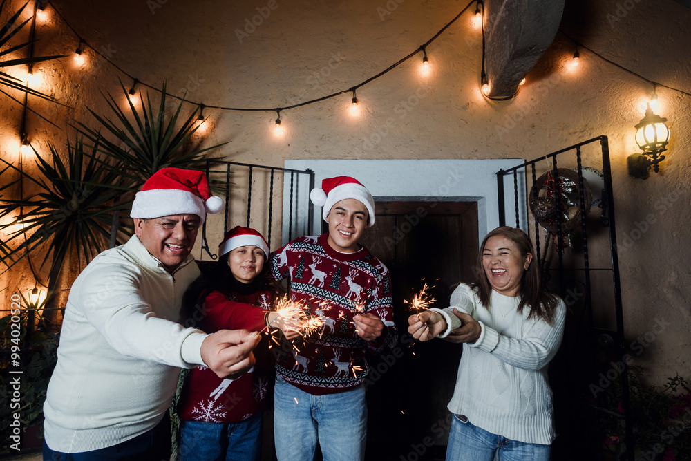 Mexican family with sparkling lights and Singing carols in Christmas ...