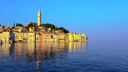 Wall Mural - the breathtaking view of rovinj, croatia, at sunset highlights its charming waterfront architecture,