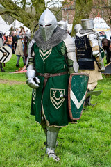 Knight fight, show fight of disguised knights and warriors, medieval soldiers with swords and shields at medieval market in Graefenthal Monastery, Goch, Kleve, North Rhine-Westphalia