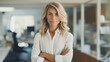 © Misau - portrait business woman in office.
