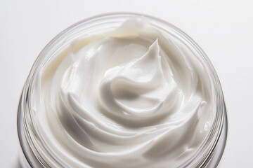 Wall Mural - open glass jar of white skincare cream product against white background.