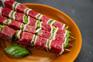 kebab raw meat vegetable pork, lard, pepper, vegetable dish fresh delicious gourmet food background on the table rustic food top view copy space