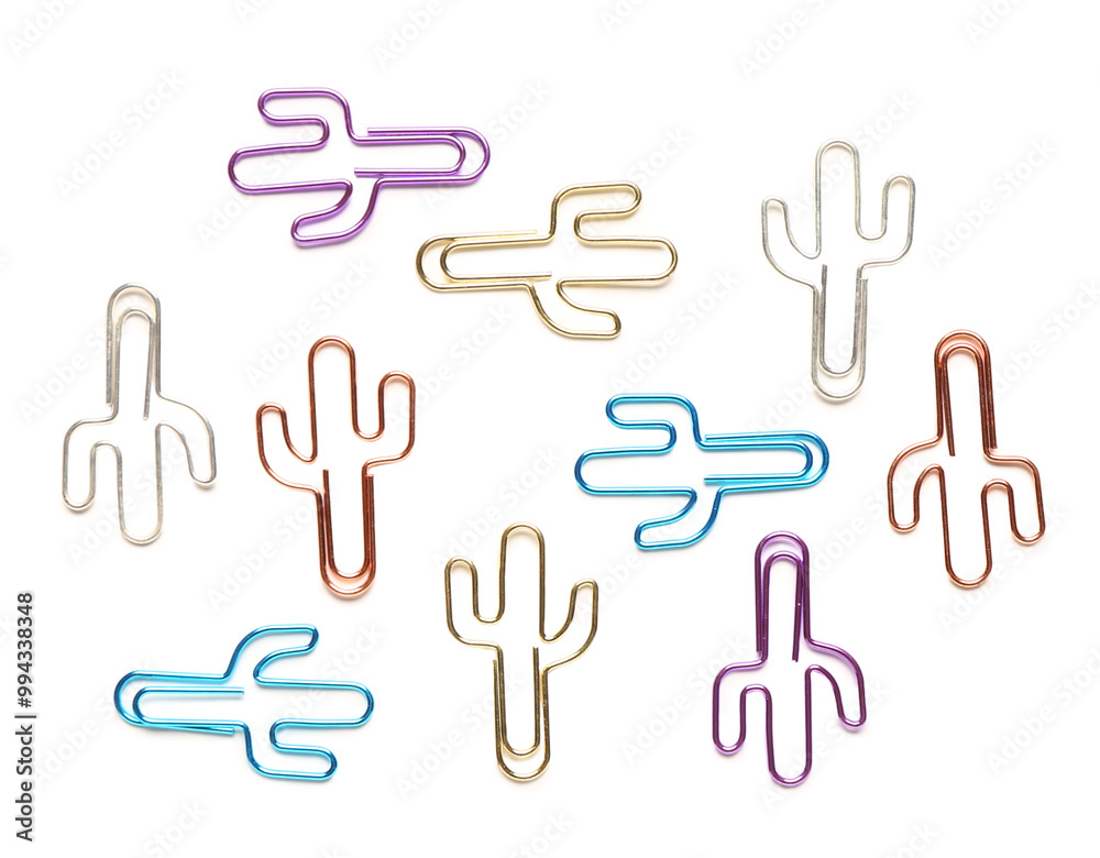 Colorful binder clips in shape of cactus on white background