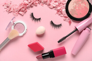 Wall Mural - Creative composition with decorative cosmetics, makeup accessories and false eyelashes on pink background