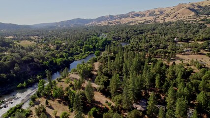 Sticker - flying over a river in california 