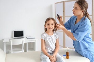 Poster - Female doctor with magnifier checking little girl's head for pediculosis in clinic