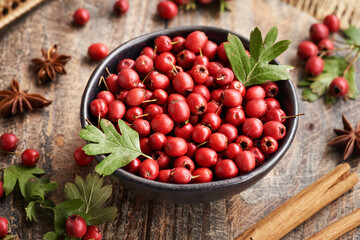 Wall Mural - Fresh hawthorn berries harvested in autumn in a bowl on a table