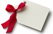© ArtCookStudio - Elegant blank gift tag with a red satin ribbon bow ready for holiday presents