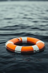 A life ring floats peacefully on calm water during a sunny day by the lake