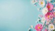 © olegganko - A colorful arrangement of pink and white flowers on a blue background for spring celebration