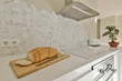 © ADDICTIVE STOCK - Modern kitchen interior with sliced bread on countertop