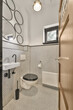 © ADDICTIVE STOCK - Modern bathroom interior with unique mirror design