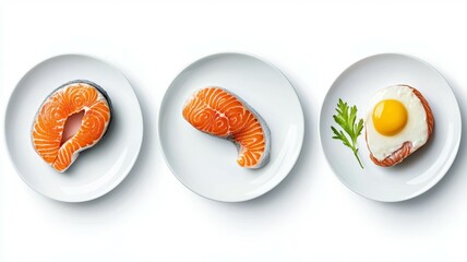 Three plates of food, one with a piece of salmon, one with an egg