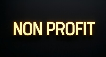 non profit word lettering with yellow glow on plain black dark background