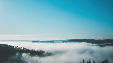 Wall Mural - Blue_sky_with_landscape_in_fog