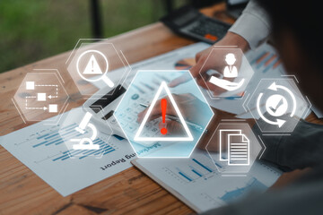 Digital icons representing incident management over business reports on a desk, highlighting risk and process management.