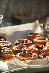 Wall Mural - Fresh baked Pastel de nata or Pastel de belém .The most famous sweet in Portugal. Tart on baking sheet/