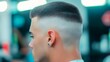 © Ratchadaporn - Closeup view of a bald fade haircut showcasing the skin tight fade on the sides and back with a slightly longer textured top for a refined modern men s hairstyle