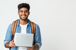© PRASANNAPIX - young indian student holding laptop on white background