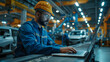 © SS Digital - Car Factory Engineer in Work Uniform Using Laptop Computer with Spreadsheet Software. Working with Software at Automotive Industrial Manufacturing Facility Dedicated for Vehicle