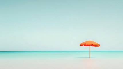 Lone orange beach umbrella against a serene turquoise ocean and blue sky.