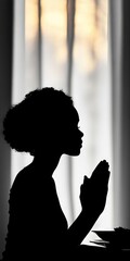 Canvas Print - silhouette of a person giving thanks before a thanksgiving meal.
