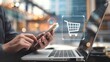 © Rajob - Business ecommerce concept. Person use smartphone and laptop with online shopping cart icon on virtual screen. online purchase, ecommerce store, online business, shopping.