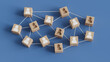 © MotionIsland - Building Team Concept with Wooden blocks connected together on a blue background. Hiring concept