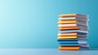 © Kittipong - Stack of Colorful Paper Brochures on Blue Background