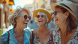 © SS Digital - Three senior women having fun laughing out loud outside - Happy female friends talking together walking on city street - Life style concept with mature females hanging outdoors