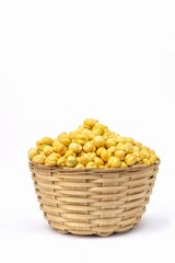 Wall Mural - Garbanzo Bean or Chickpea in a Bamboo Basket Isolated on White Background with Copy Space, Also Known as Bengal Gram or Egyptian Pea in Vertical Orientation