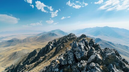 View from mountain peak under clear sky