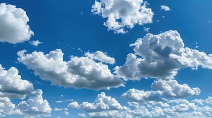 Fluffy clouds in a clear blue sky