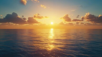 A beautiful sunrise over a tranquil ocean with the sun rising above the horizon.