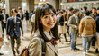 © Big - Asian young woman in school uniform, With smile, in a blurred crowd walking through a zebra crossing